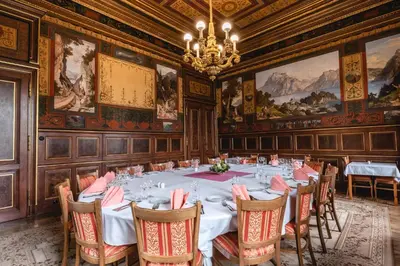 a dining room with a long table and chairs at Vila Lanna in Prague