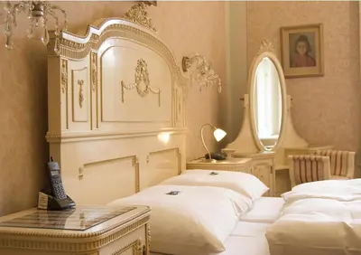 a bedroom with two white beds and a mirror at Vila Lanna in Prague