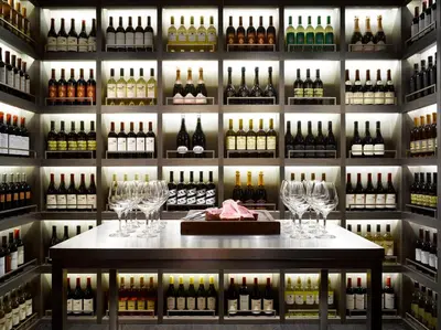 a room filled with lots of bottles of wine at The Emblem Prague Hotel in Prague