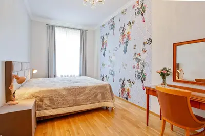 a bedroom with a bed and a desk and a mirror at Newly opened, designer OPERA Apartment in Prague