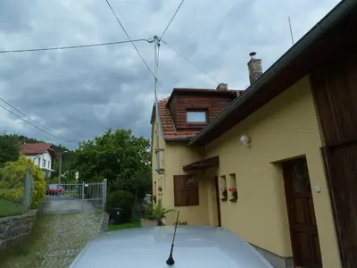 a car parked in front of a house at Apartmá u Hovorků in Županovice