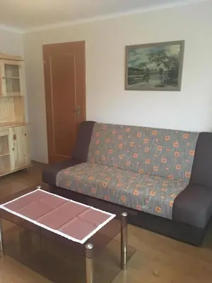 a living room with a couch and a coffee table at Apartmá u Hovorků in Županovice