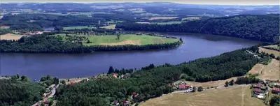 an aerial view of a lake with a golf course at Apartmá u Hovorků in Županovice