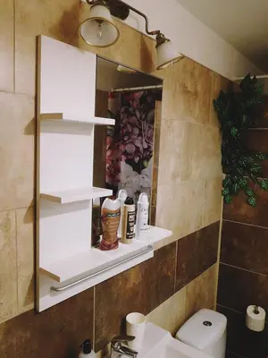a bathroom with a mirror and a sink and a toilet at Studio Boroví in Karlštejn