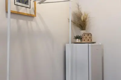 a white refrigerator with a plant on top of it at Awesome Stay Studios in Prague