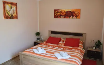 a bedroom with a bed with two towels on it at Apartment Boroví in Karlštejn