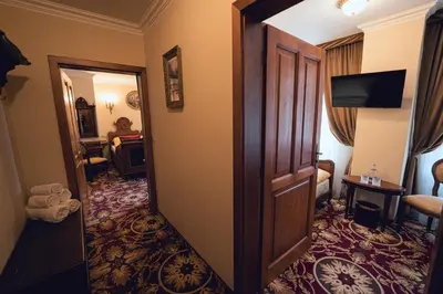 a hotel room with a door leading to a living room at Hotel Svatojánský Dvůr in Prague