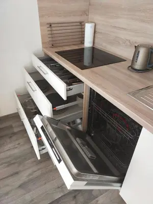 a kitchen with a counter with an oven in it at Apartmán Karolína in Poděbrady