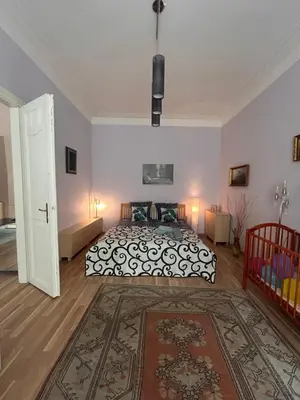 a bedroom with a large bed and a large rug at Super Old Town in Prague