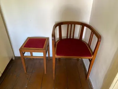 two wooden chairs and a table in a room at Old Summer House with renovated bathroom in Prague