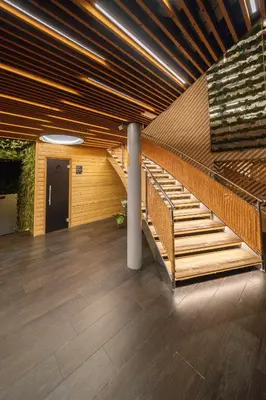 a lobby with a staircase in a building at Wellness Hostel Central in Prague