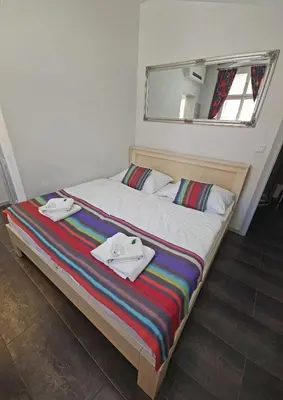 a bedroom with a bed with towels on it at Historic Centre Residence in Prague