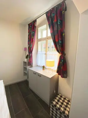 a small room with a desk and a window at Historic Centre Residence in Prague