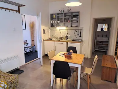 a kitchen and dining room with a table and chairs at Magnificent apartment in the center of Prague in Prague