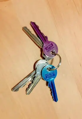 a pair of keys sitting on top of a table at Magnificent apartment in the center of Prague in Prague