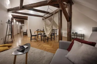 a living room with a couch and a table at White Swan Boutique Apartments in Prague