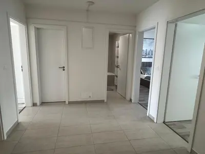 an empty room with white walls and a tile floor at Spacious 2BR with balcony in Prague - Comfort & Style in Prague