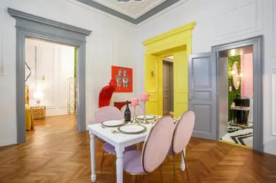 a dining room with a white table and chairs at Palace Apartment by Main Station - President in Prague