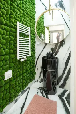 a bathroom with a green wall and a mirror at Palace Apartment by Main Station - Premier in Prague