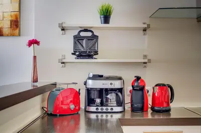 a kitchen with several appliances on a counter at Selinor Old Town Apartments in Prague