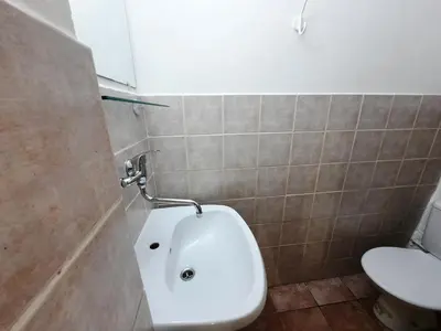 a bathroom with a toilet and a sink at Pension City Center in Prague