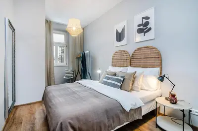 a small bedroom with a bed and a window at Charming Apartments Prague by Michal&Friends in Prague