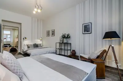 a bedroom with two beds and a window at Charming Apartments Prague by Michal&Friends in Prague