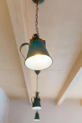 two lights hanging from a ceiling at Exclusive penzion Viva Residence in Mladá Boleslav