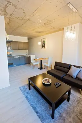 a living room with a couch and a table at Exclusive penzion Viva Residence in Mladá Boleslav