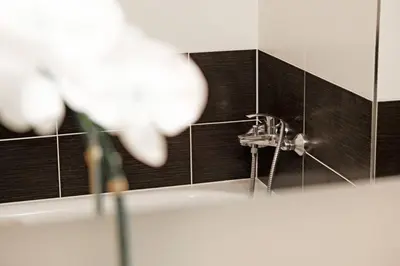 a bathroom with a sink and a faucet at Sublime Studio with Big Terrace in Prague