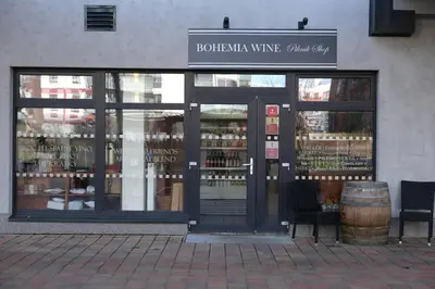 a wine shop with a barrel in front of the door at Sublime Studio with Big Terrace in Prague