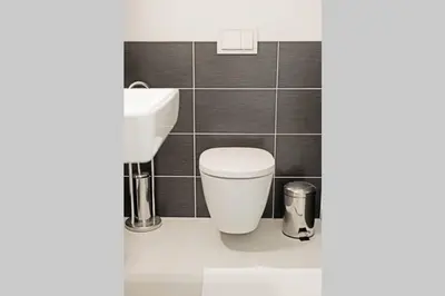 a bathroom with a toilet and a sink at Sublime Studio with Big Terrace in Prague