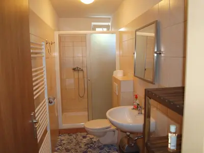 a bathroom with a toilet and a sink and a shower at BAILANDO Studio in Neratovice