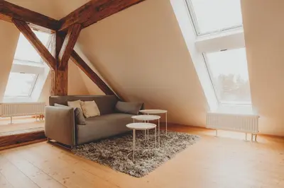 a living room with a couch and two tables at Penzion Nový Rybník in Obořiště