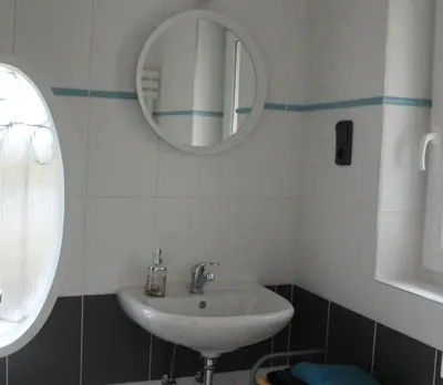 a bathroom with a sink and a mirror at Domek Praha - Zbraslav, u zámku in Prague