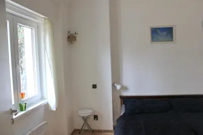 a bedroom with a bed and a window at Domek Praha - Zbraslav, u zámku in Prague