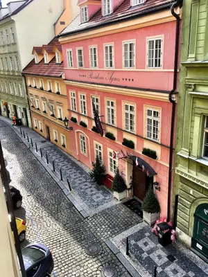 an empty street in a city with buildings at Charming Old Town Retreat in Prague