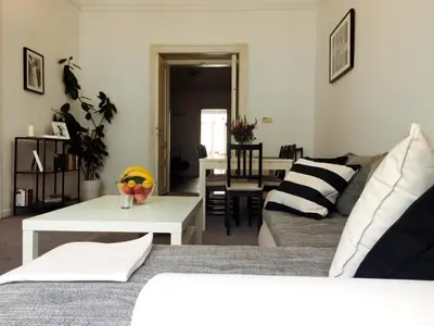 a living room with a couch and a table at VIP city CENTER apartment Prague in Prague