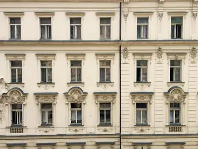 a facade of a white building with windows at VIP city CENTER apartment Prague in Prague