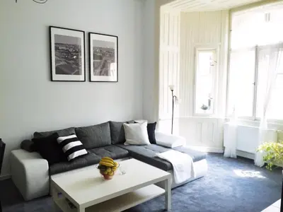 a living room with a couch and a table at VIP city CENTER apartment Prague in Prague