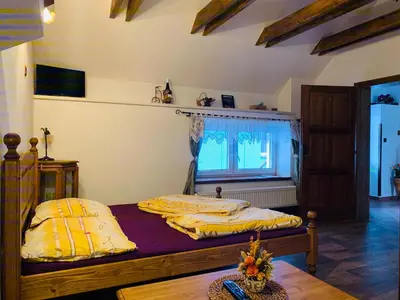 a bedroom with two beds and a window at Penzion Na Růžku in Sedlčany