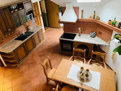 an overhead view of a kitchen with a table and chairs at Penzion Na Růžku in Sedlčany