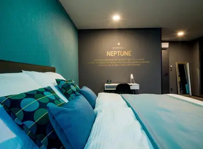 a bedroom with a bed and a sign that says reptine at Rooftop Planet Prague Hotel in Prague