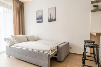 a bedroom with a bed in a room at Mozart Central Apartments with garage in Prague