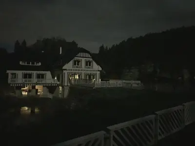 a house at night with its lights on at penzion a kemp Harasov in Vysoká