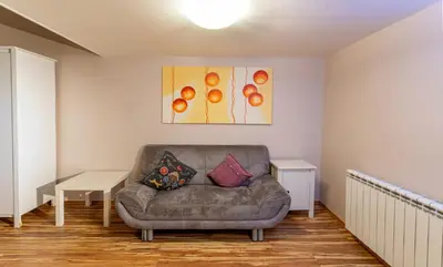 a living room with a couch and a table at Michalska Apartment in Prague