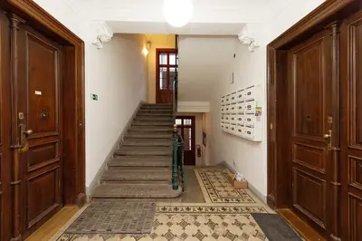 a hallway with a staircase in a building at Apartment Manesova 4 in Prague
