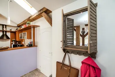 a mirror hanging on the wall in a kitchen at LaNoblessa in Prague