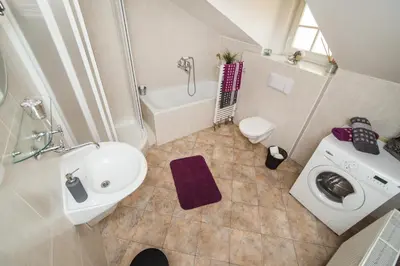 a small bathroom with a sink and a toilet at LaNoblessa in Prague