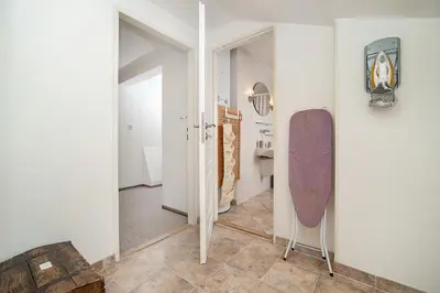 a room with a skateboard leaning against a wall at LaNoblessa in Prague
